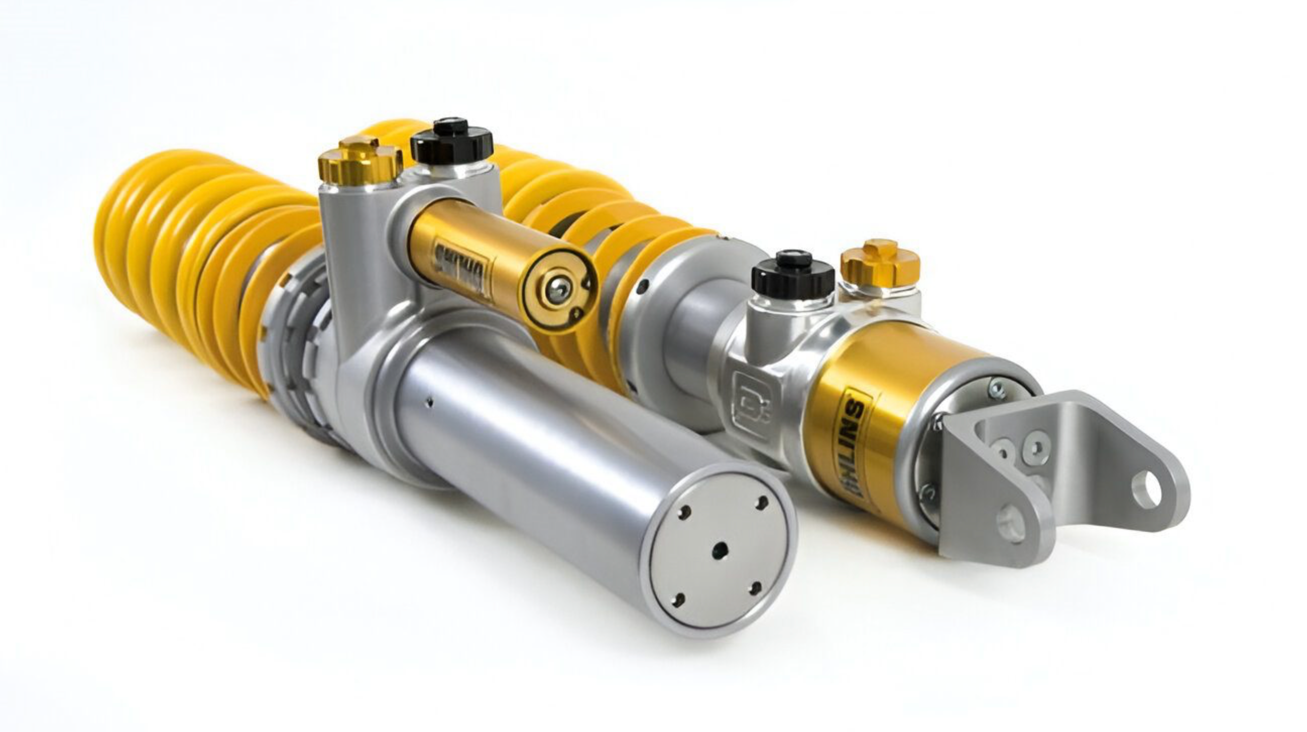 Ohlins coilers - showing two shock absorbers with yellow and silver design on a white background